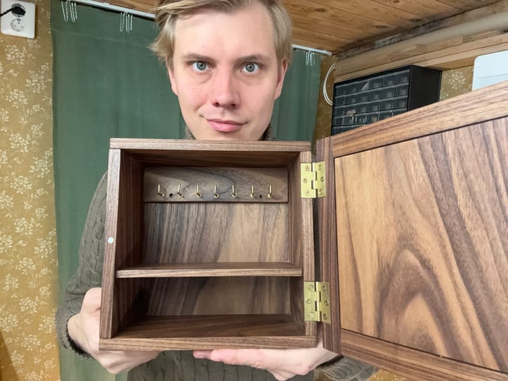 Me holding the finished key cabinet